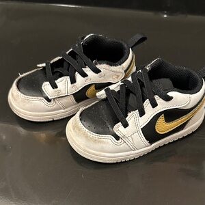 Nike Kids Sneakers in Black, White, and Gold